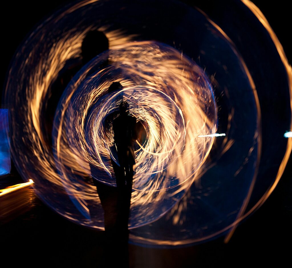 pexels photo 266429 266429 Mesmerizing long exposure shot of fire spinning and silhouette at night.